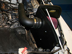 An AIRAID 312-176 Cold Air Dam Performance Intake System installed on a Jeep Wrangler YJ 2.5L