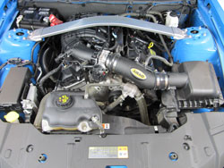 2011-2014 Ford Mustang engine bay with AIRAID 451-745 intake installed.