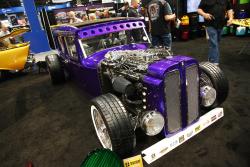 1929 Ford Sedan in House of Kolor booth with AIRAID filter at 2016 SEMA show