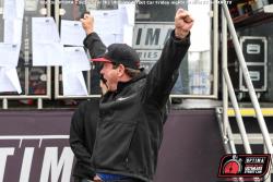Photo pf Ken Thwaits with hands in air after learning about his win!