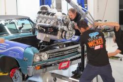 Photo of the W2W Team installing the BluePrint Engines built 427c.i. stroker motor w/ 625hp