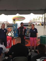 Shot of Jordan Priestley accepting his trophy as Grand Champion NMCA West Hotchkis Cup Series