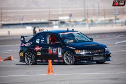 Photo of Thwaits and his 2006 EVO on the Detroit & Engineering Autocross